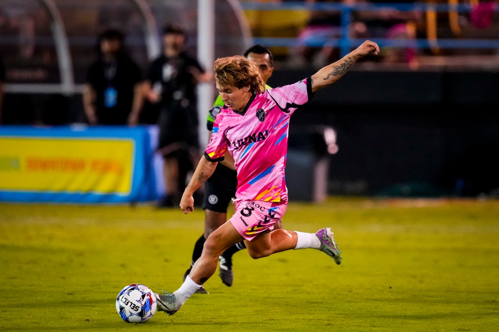 Las Vegas Lights FC forward Coleman Gannon kicking a ball