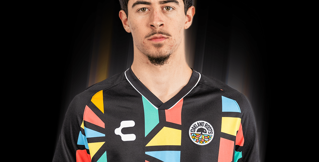 Tomas Caminos is wearing an Oakland Roots SC Primary kit jersey.