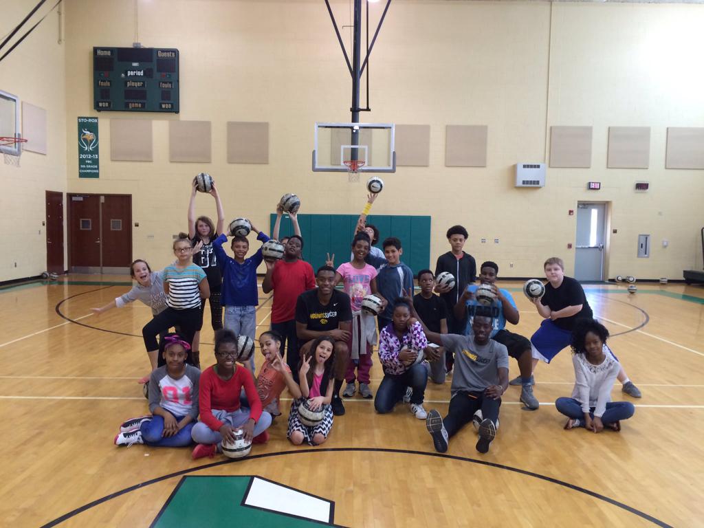 Picture of two Pittsburgh Riverhounds players with kids from a local school district as part of the sub in for a gym class program. 