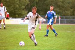 Picture of Justin Evens dribbling a soccer ball in a game for the Pittsburgh Riverhounds