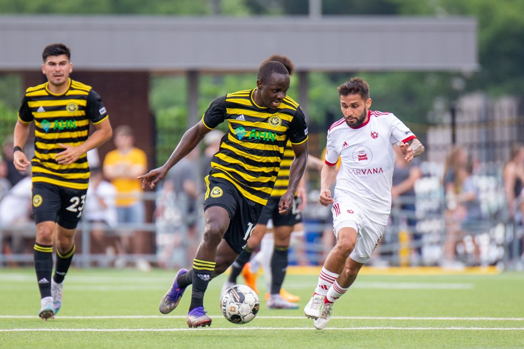 Edward Kizza dribbles the ball upfield for the Riverhounds in their 1-0 win over Phoenix Rising FC on June 3, 2023 at Highmark Stadium.