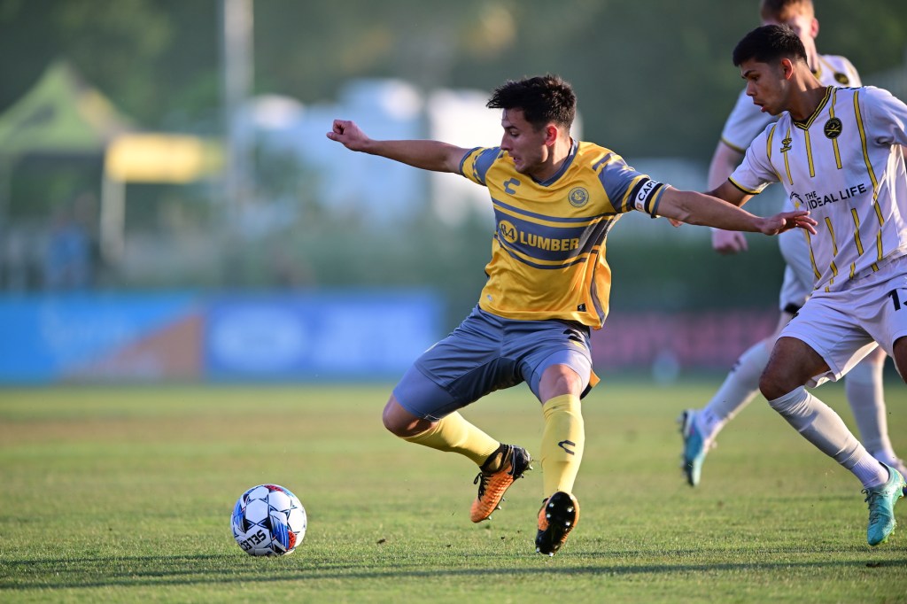 Danny Griffin battling for the ball against a Charleston Battery player in the Hounds' 0-0 on June 8, 2024 at Patriots Point Soccer Complex in Mount Pleasant, S.C.