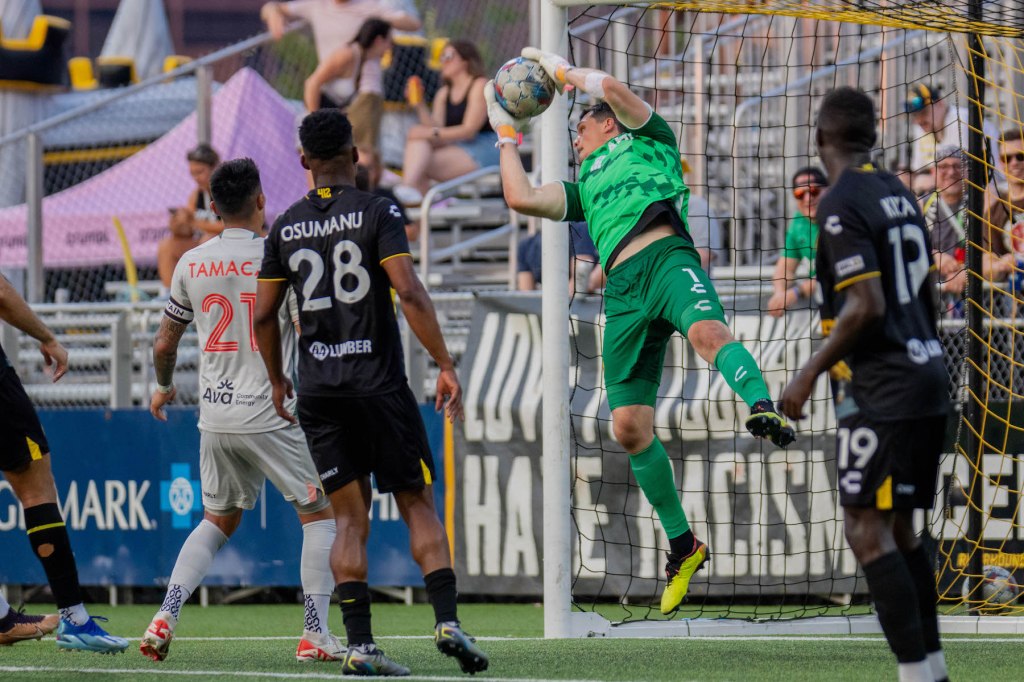 Hounds goalkeeper Eric Dick makes a catch in the team's 5-0 win over Oakland Roots SC on July 13, 2024 at Highmark Stadium. (Photo: Chris Cowger/Riverhounds SC)
