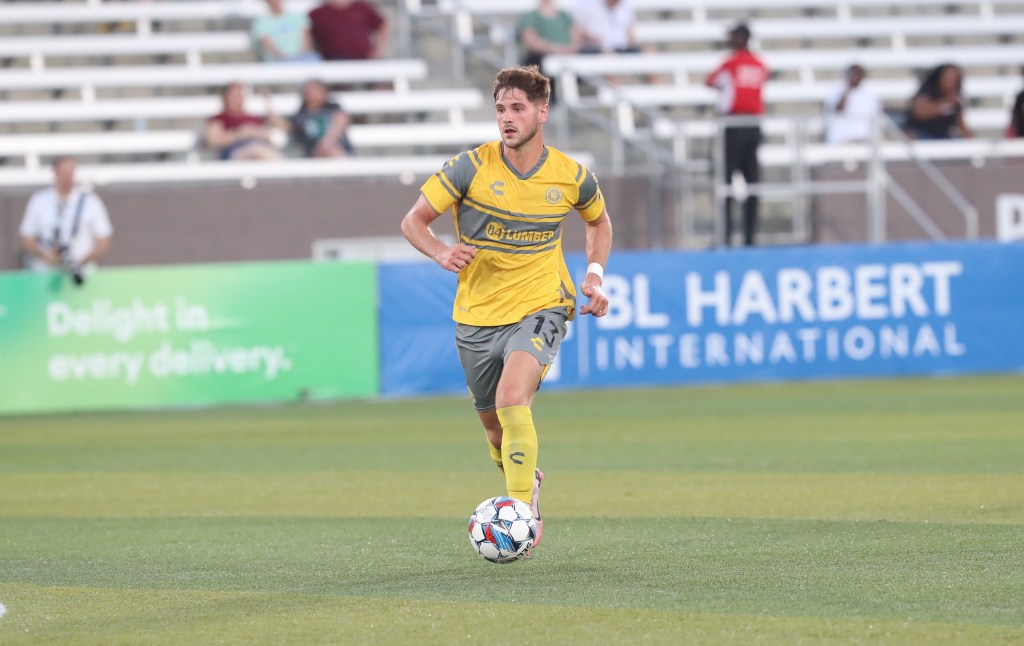 Pittsburgh Riverhounds player Luke Biasi dribbles the ball against Birmingham Legion FC on Aug. 24, 2024, at Protective Stadium in Birmingham, Ala.