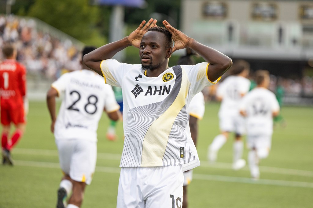 Pittsburgh Riverhounds forward Edward Kizza celebrates after scoring a goal against Hartford Athletic on July 20, 2024, at Highmark Stadium in Pittsburgh