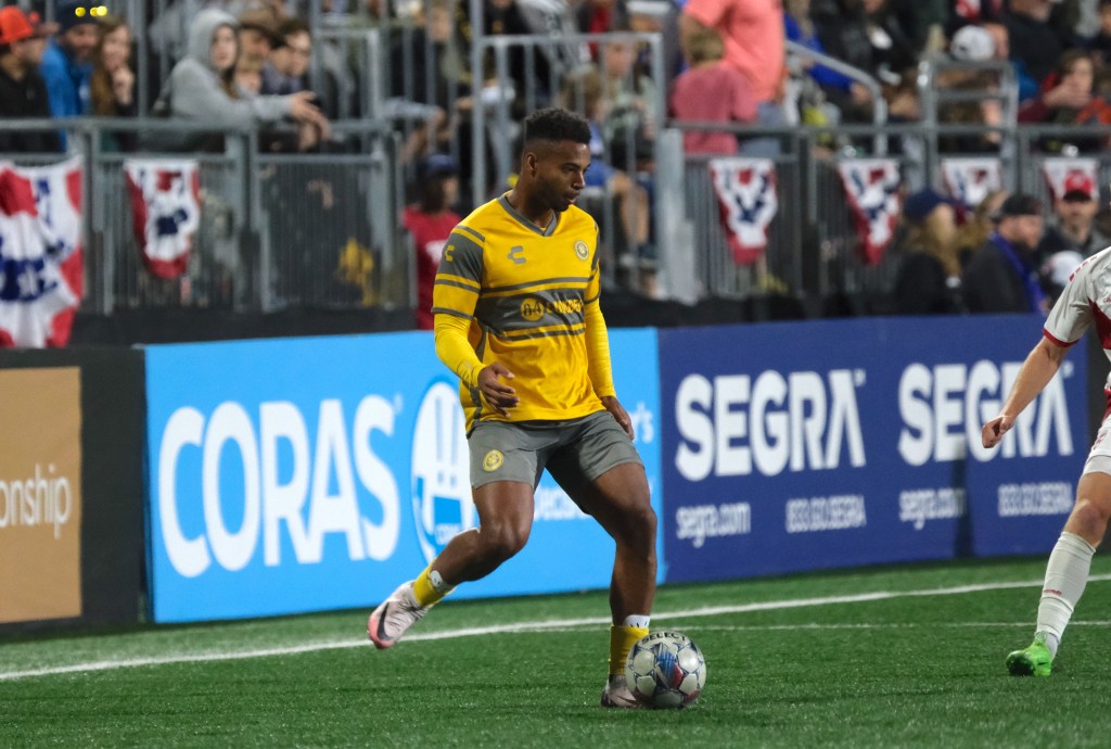 Pittsburgh Riverhounds wing back Langston Blackstock plays a pass against Loudoun United FC on Oct. 19, 2024 at Segra Field in Leesburg, Va.