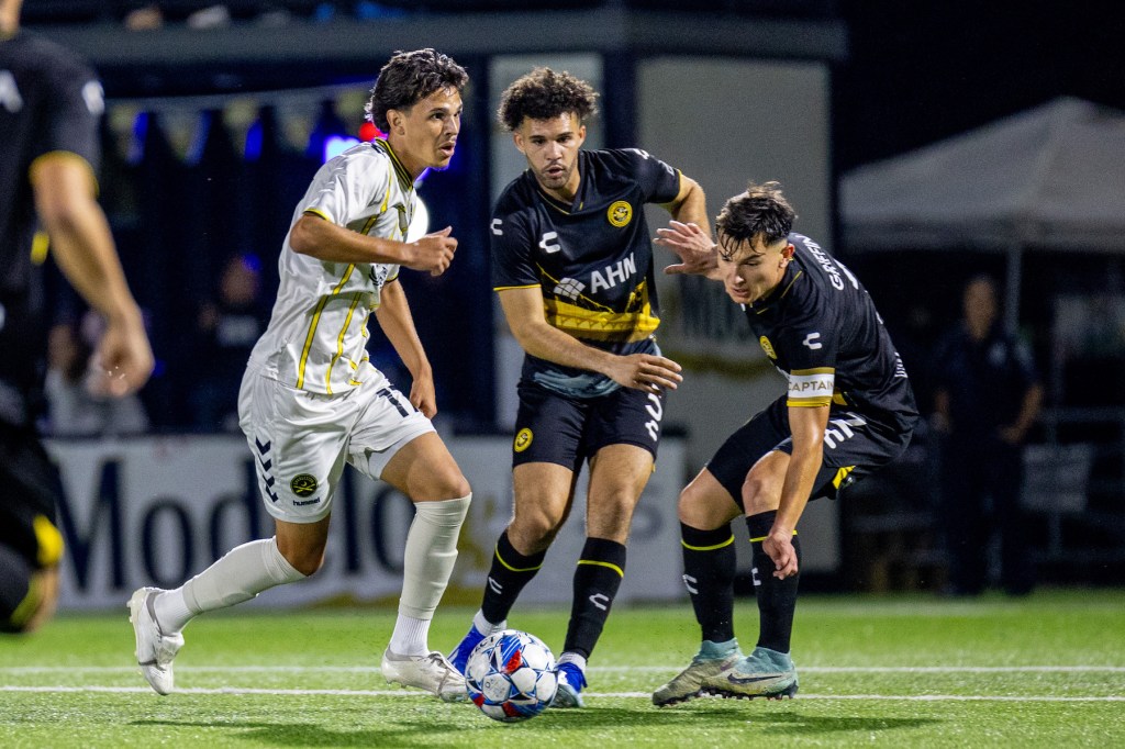 Pittsburgh Riverhounds Players Sean Suber and Danny Griffin making a tackle against the Charleston Battery who will square off in the USL championship Playoffs