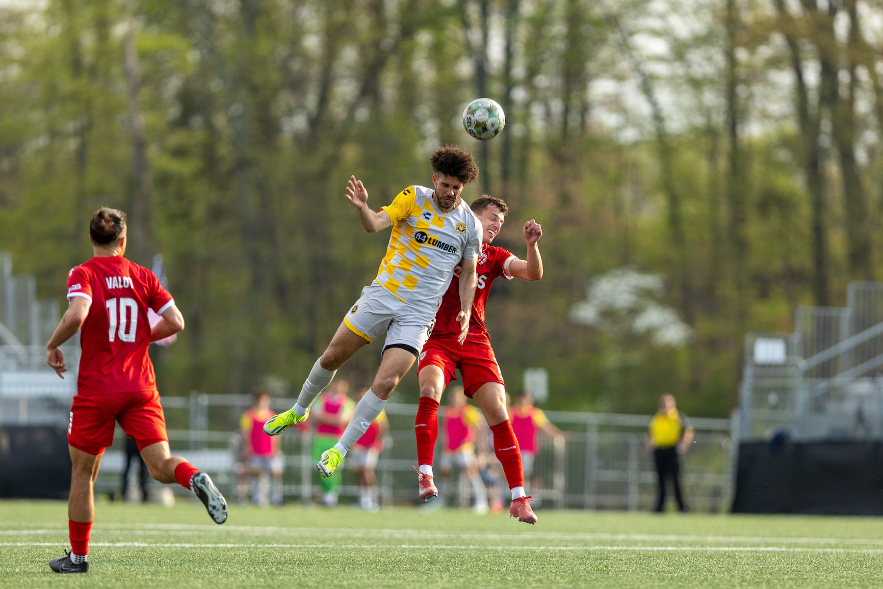 Sean Suber elevates to win a header in front of Loudoun United FC's Zach Ryan in the Riverhounds' match on April 19, 2025 at Segra Field in Leesburg, Va. (Photo: Mallory Neil/Riverhounds SC)
