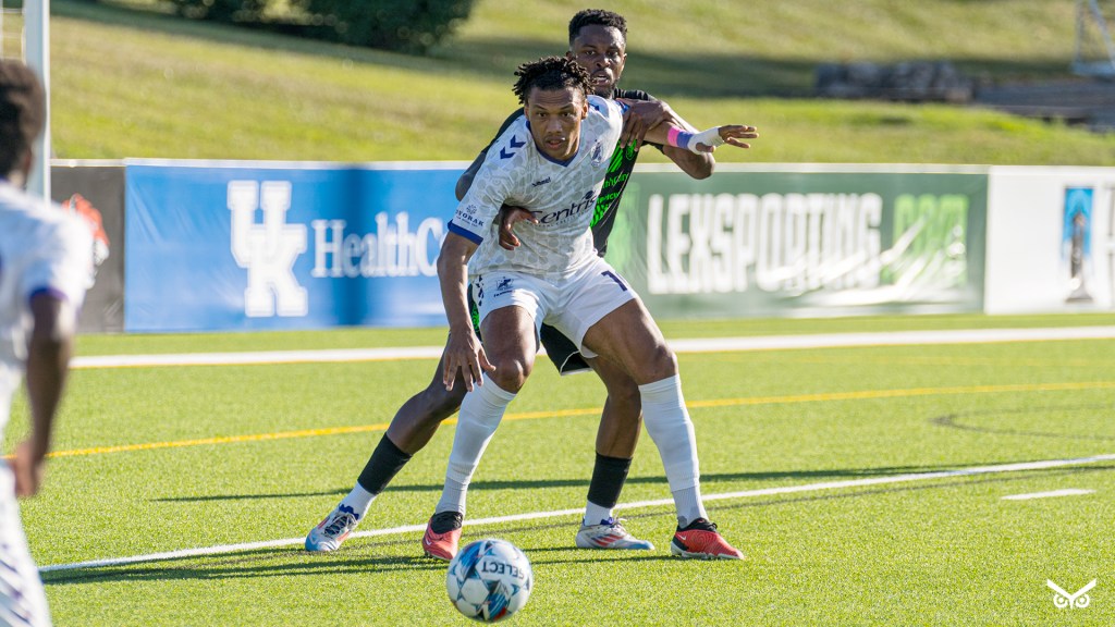Steevan Dos Santos holding off a Lexington SC defender